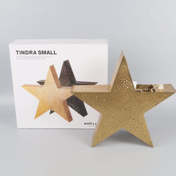 Guldfärgad julstjärna med originalförpackning