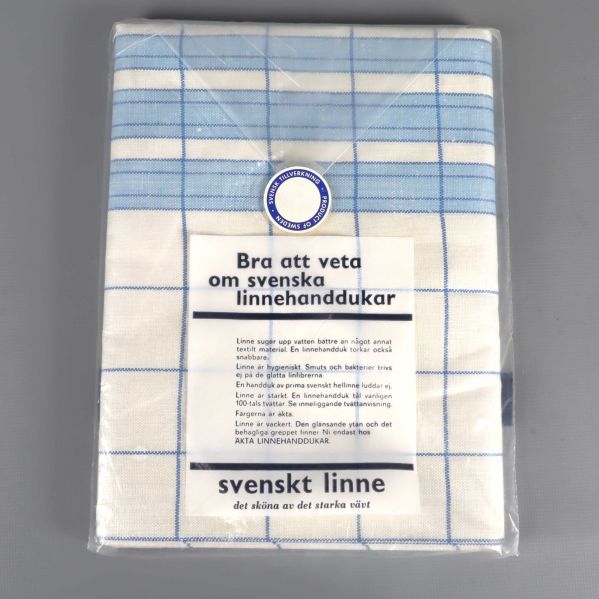 Baksidan av blåvit linnehandduk