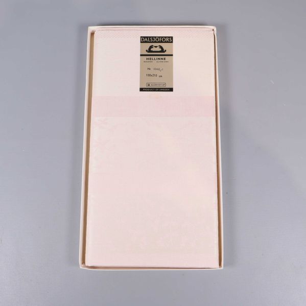 Duk i ask med synlig etikett inuti förpackningen