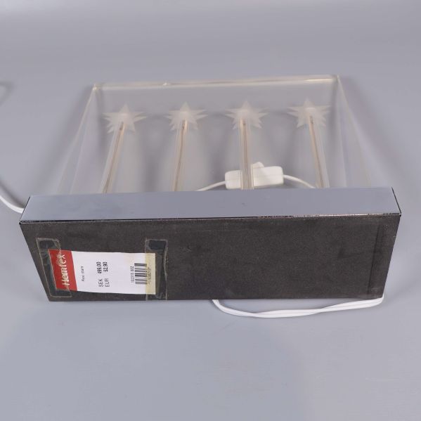 Adventsljusstake i förpackningen med etikett 