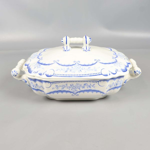 Sopptérin sedd framifrån med båda handtag och blå blomstermönster