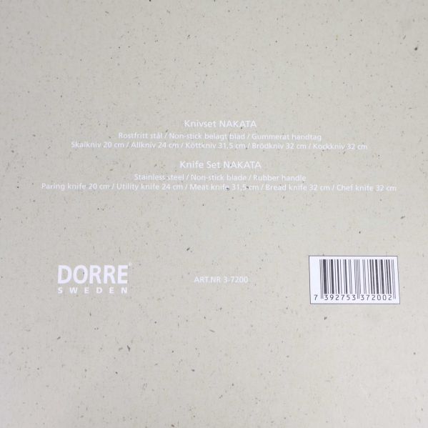 Baksida av förpackning med produktinformation om knivset