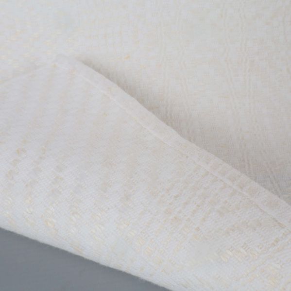 Hörn av vit duk vikt med synlig struktur