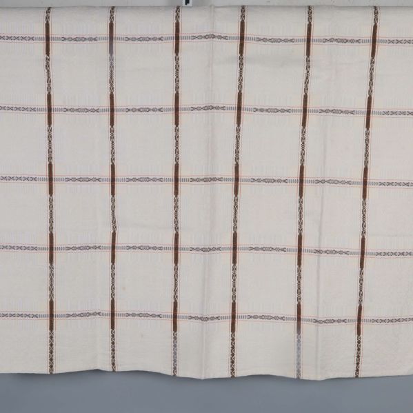 Hel duk utbredd med bruna och beige rutor