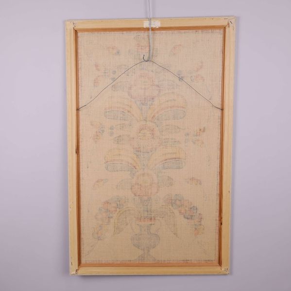 Baksidan av bonaden med upphängningsvajer