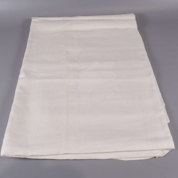 Vit duk utvikt på slät yta