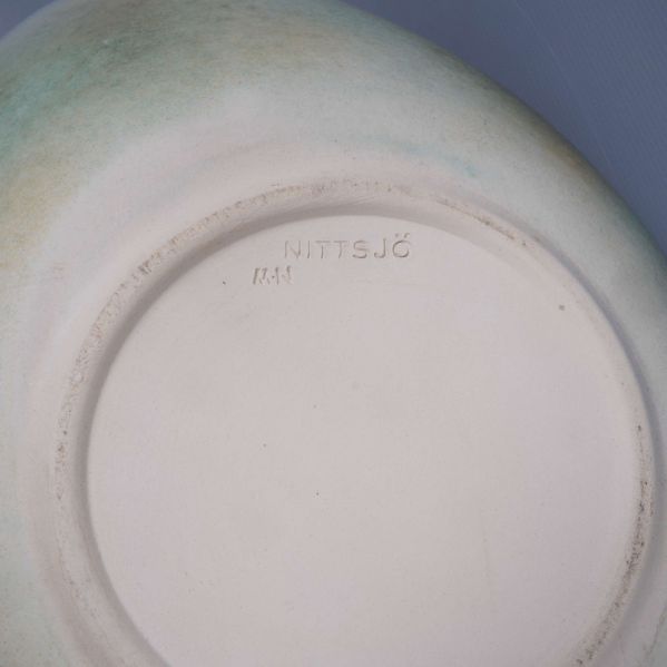 Närbild av stämpel med texten NITTSJÖ