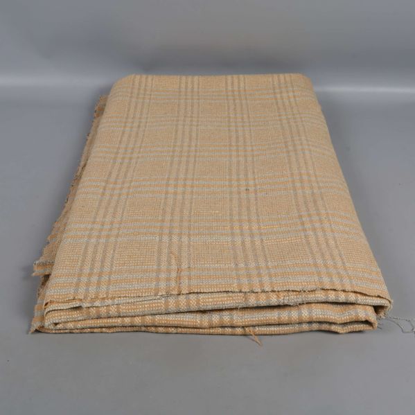 Vikt rutigt tyg i beige och gula toner