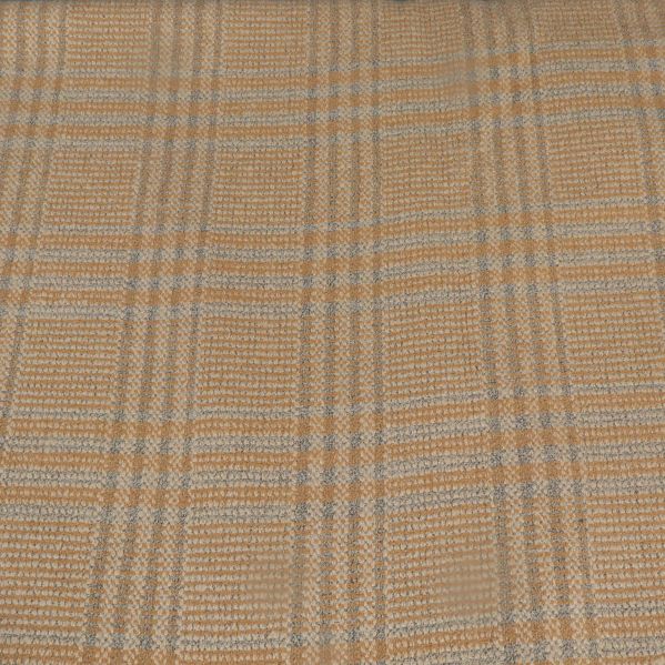 Närbild av rutigt tygmönster och vävd struktur