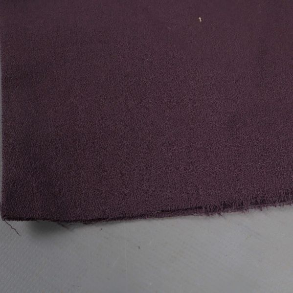 Närbild på tygkant med rå avslutning