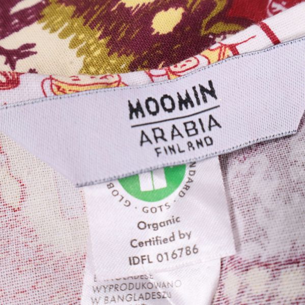 Etikett med text Moomin Arabia Finland och certifieringar