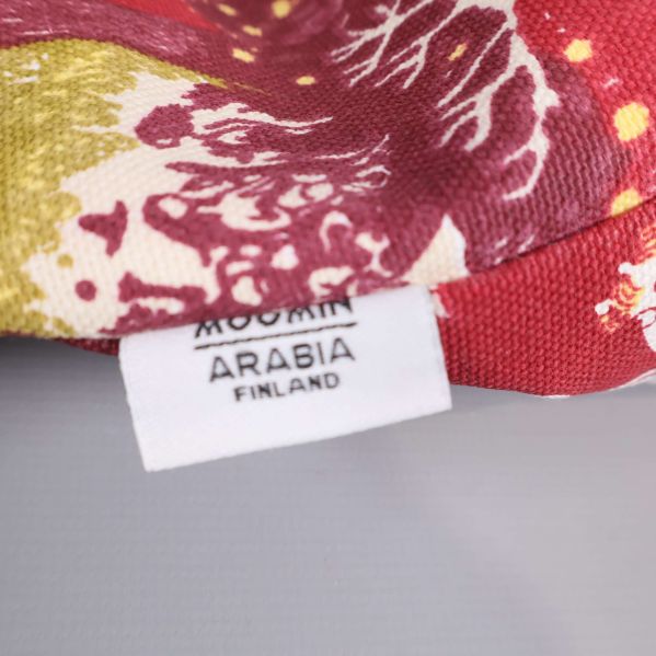 Textiletikett med texten Moomin Arabia Finland
