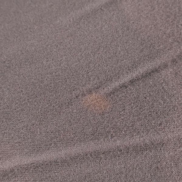 Detalj på tyg med mindre fläck