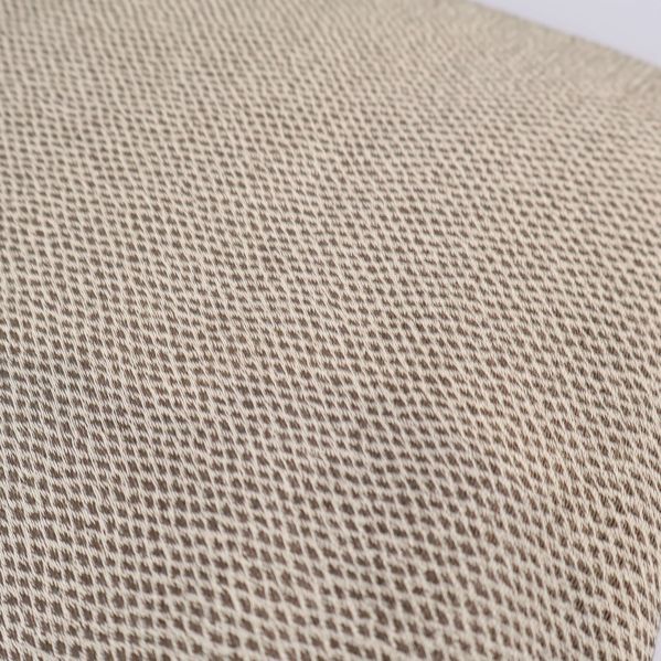 Närbild på beige tygs vävda struktur