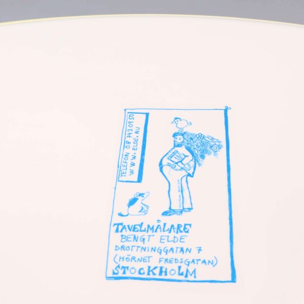 Etikett med blå illustration och text Stockholm