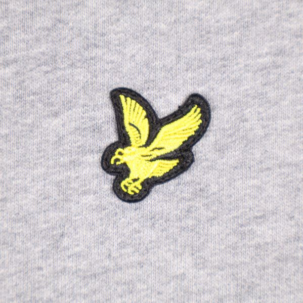 Detalj av ett fågellogo på sweatshirt