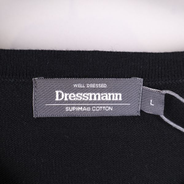 Dressmann-logga med materialdetaljer på etikett