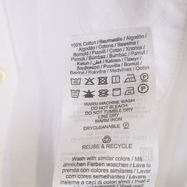 Materialetikett med tvättråd för skjorta