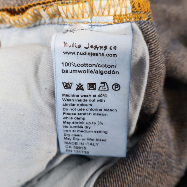 Materiallabel som visar 100% bomull