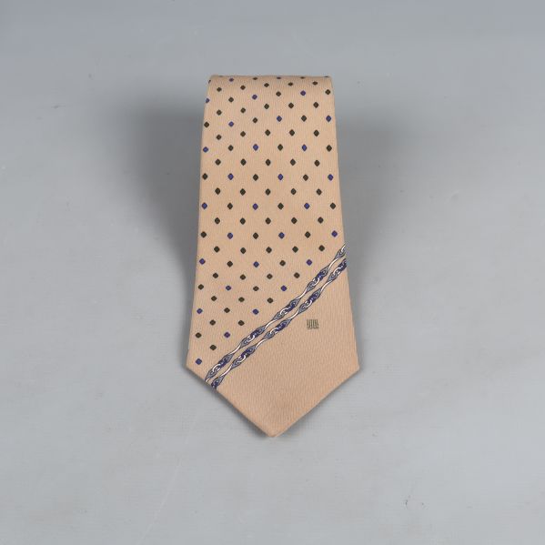 Beige slips med svarta och blå prickar