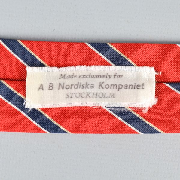 Etikett från AB Nordiska Kompaniet Stockholm