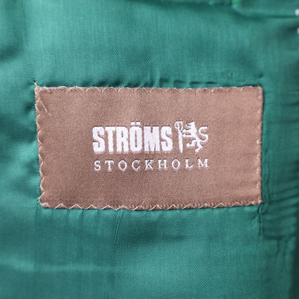 Ströms Stockholm etikett på grönt foder
