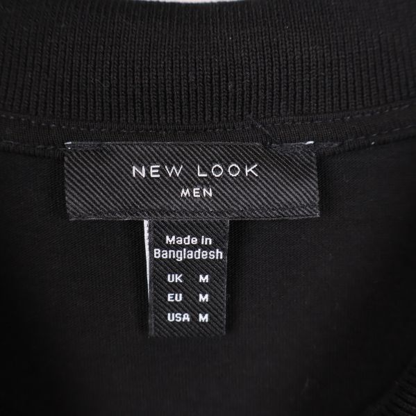 Närbild av New Look Men etikett i halsen