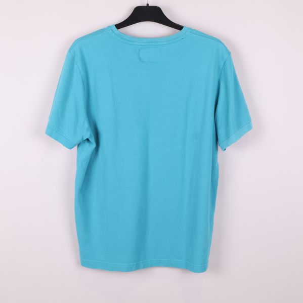 Turkos pique t-shirt sedd bakifrån