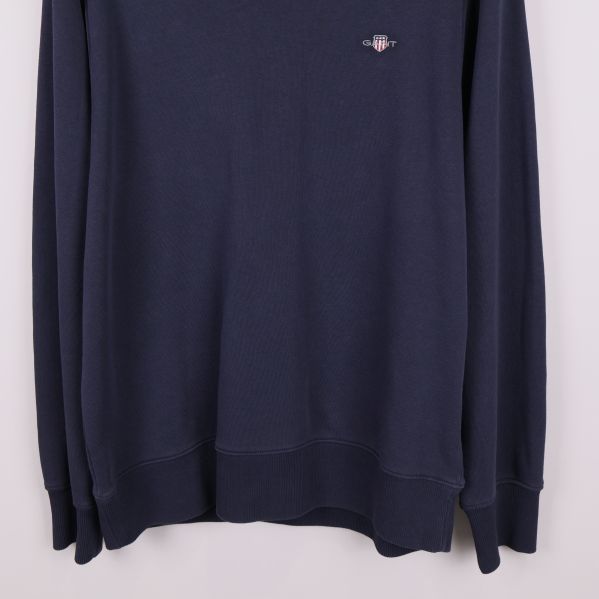 Ribbade muddar och nederkant på marinblå sweatshirt