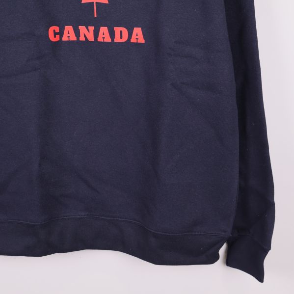 Nedre delen av sweatshirtens front och ärmmuddar