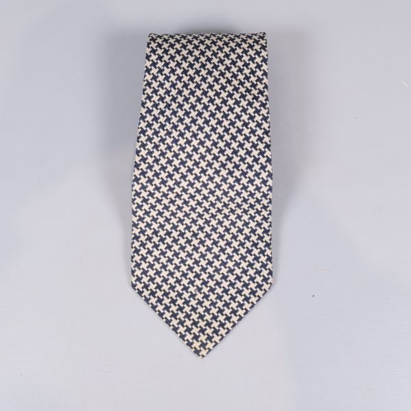 Slips med tydligt hundtandsmönster i svart och beige