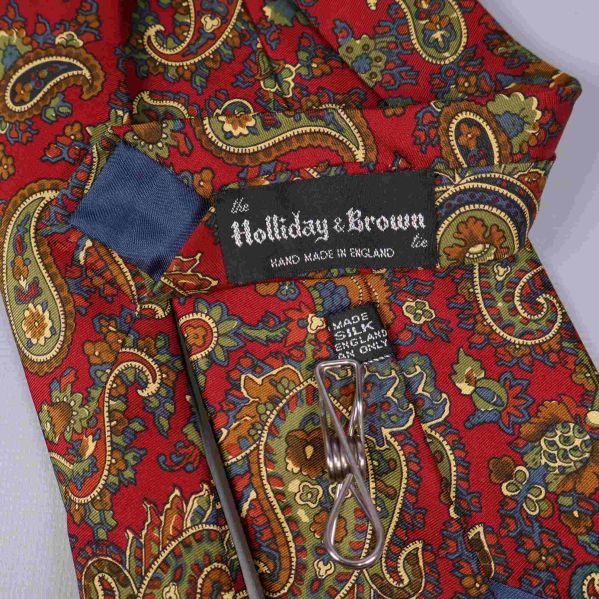 Slipsens etiketter med Holliday & Brown logga