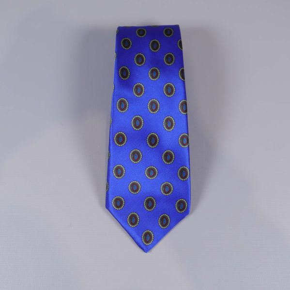 Framsidan av blå slips med flerfärgat cirkelmönster