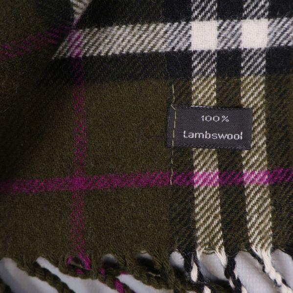 Materiallapp visar 100 procent lammull