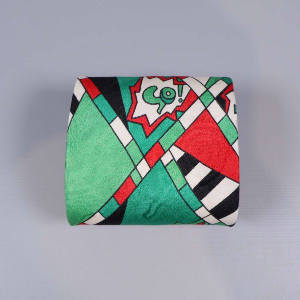 Hopvikt slips med grafiskt pastellmönster i grönt och rött