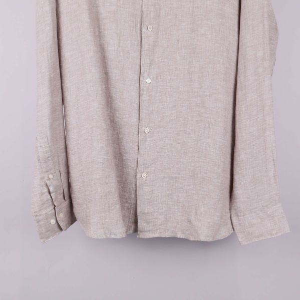 Närbild på nederdel av framstycke och ärmslut