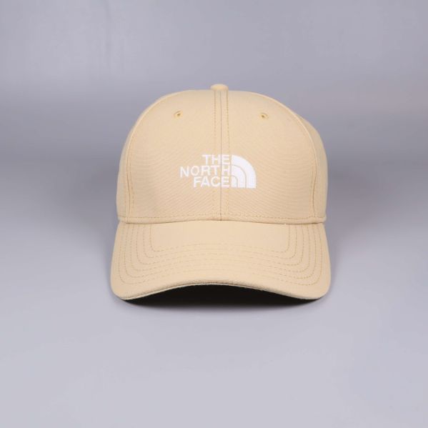 Beige keps med vit The North Face-logotyp fram