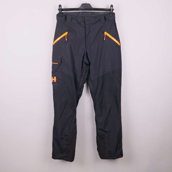 Svarta funktionsbyxor med orange dragkedjor framtill