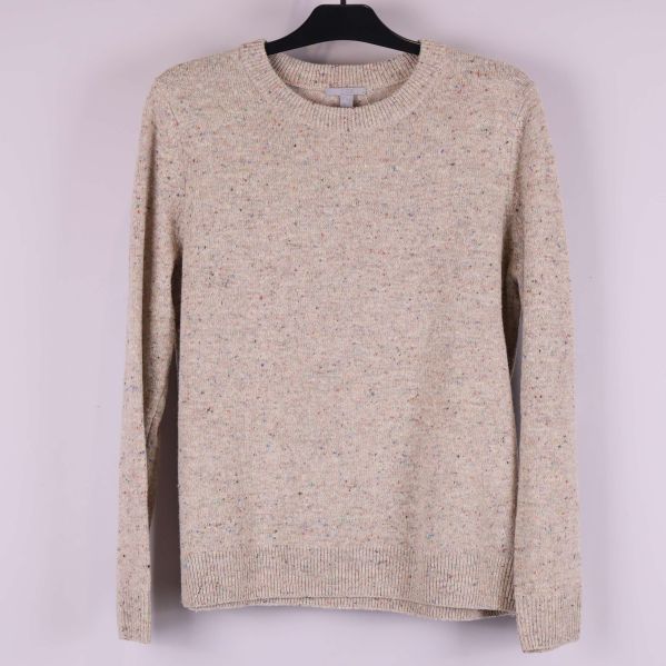 Beige melerad stickad tröja framifrån på galge