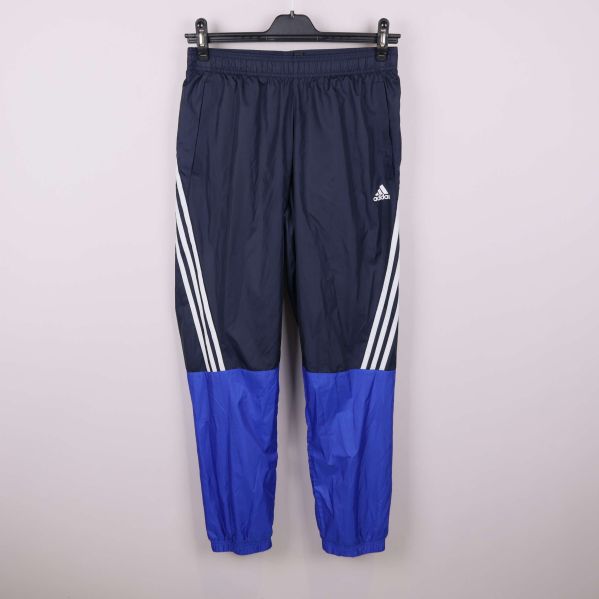 Mörkblå träningsbyxor med vita ränder och blå färgblock