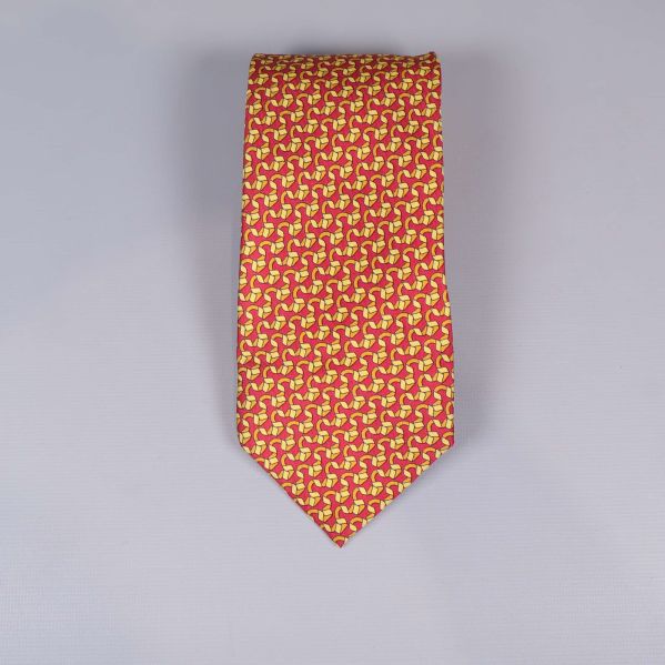 Slips med grafiskt rött och gult mönster 