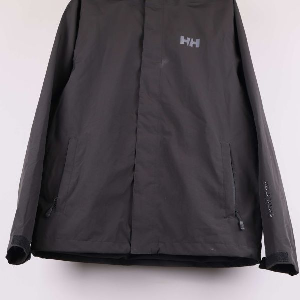 Nedre del av jacka med fickor och dragkedjor