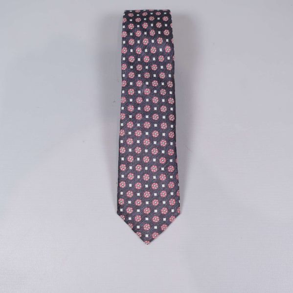 Slips med rundade mönster i rött och vitt mot mörk bakgrund