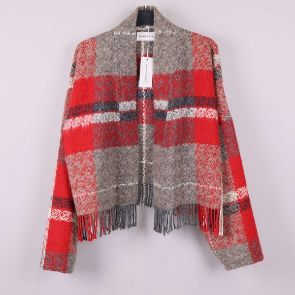 Framsidan av jacka i ull med rutigt mönster och fransar