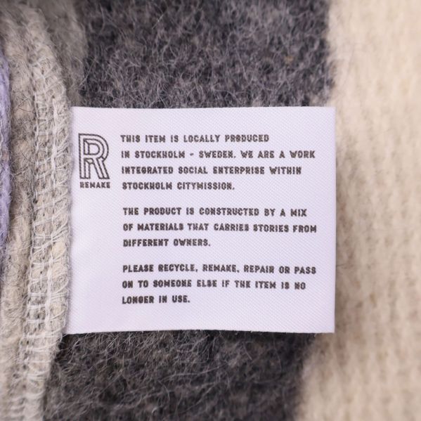 Etikett med information om lokal produktion och materialmix