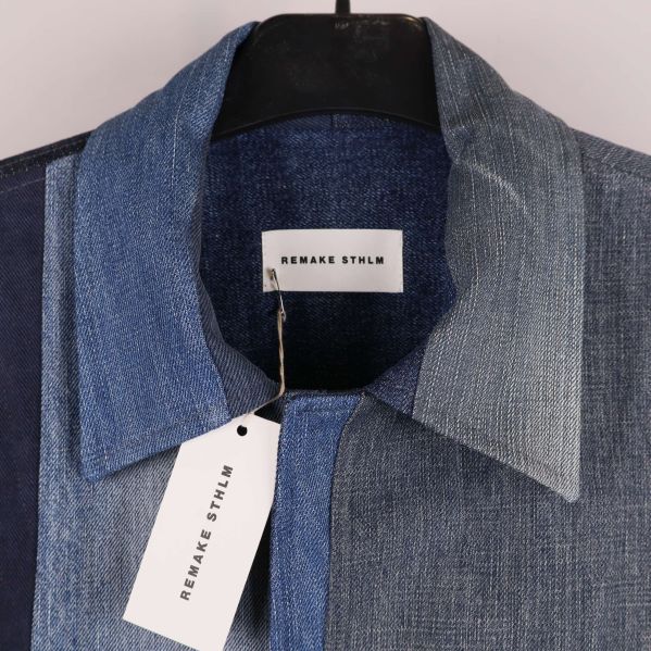 Närbild på krage och etikett REMAKE STLM