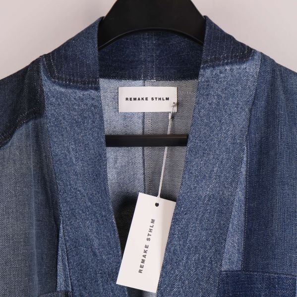 Närbild på krage och etikett från Remake Style
