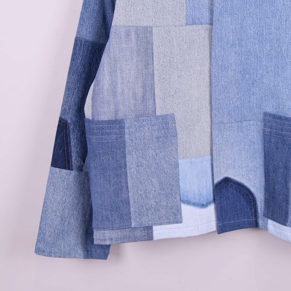 Jackans fåll och ärm med olika denimlappar