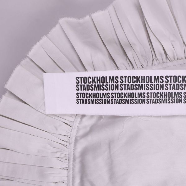 Volang och Stockholms Stadsmission text i närbild