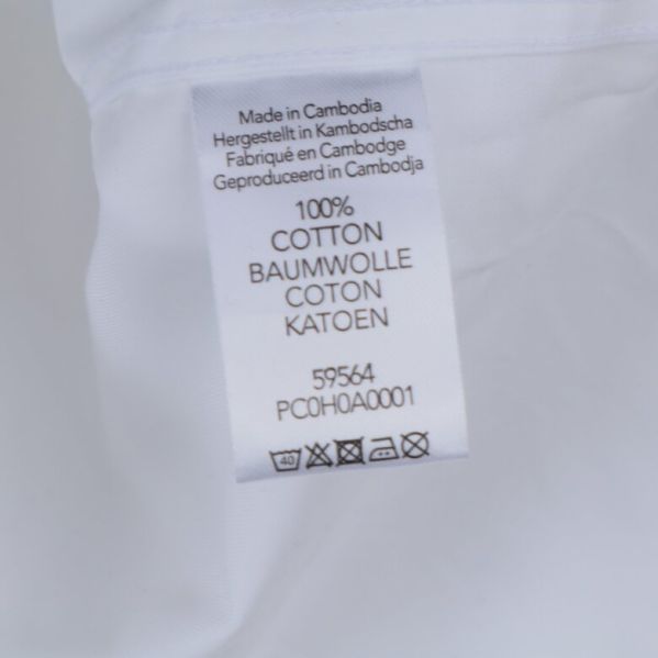 Materialetikett som visar 100% bomull